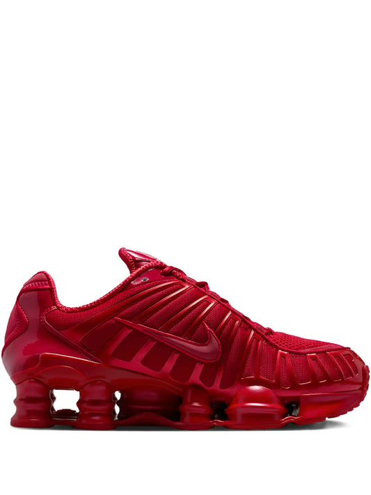 Red Nike Shox TL sneakers with visible air pods