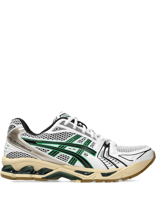 ASICS white running shoes with green striped panels, black heel, beige rubber sole