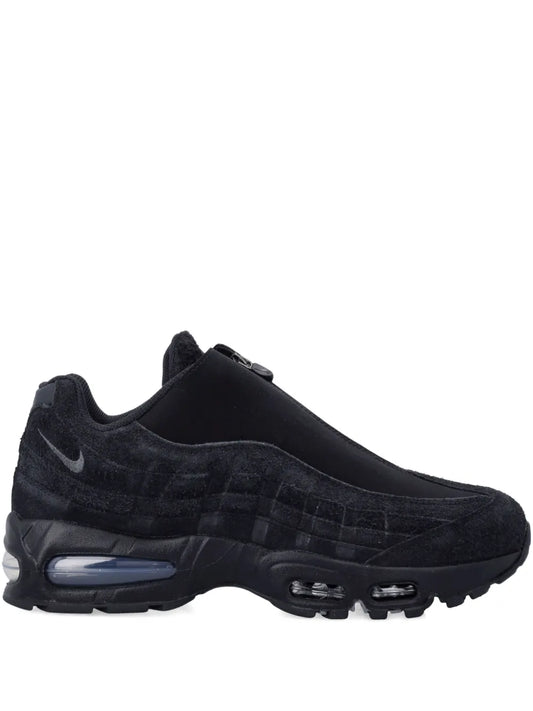 Black Nike Air Max sneaker with mesh upper and visible Air units, lace-up.