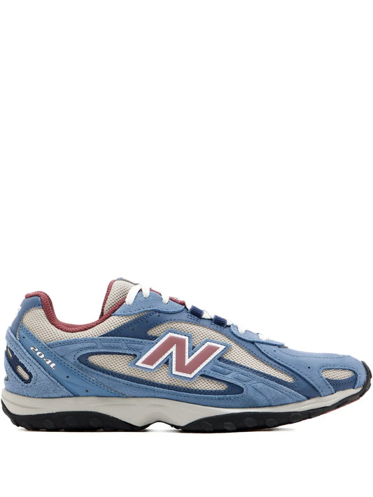 Blue running sneaker with white laces, pink/white N logo, and dark outsole