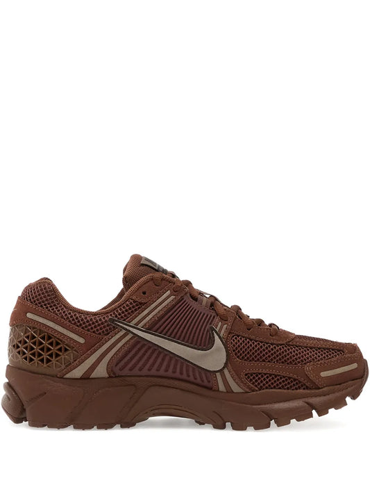 Nike brown lace-up running shoe with mesh upper and visible Swoosh