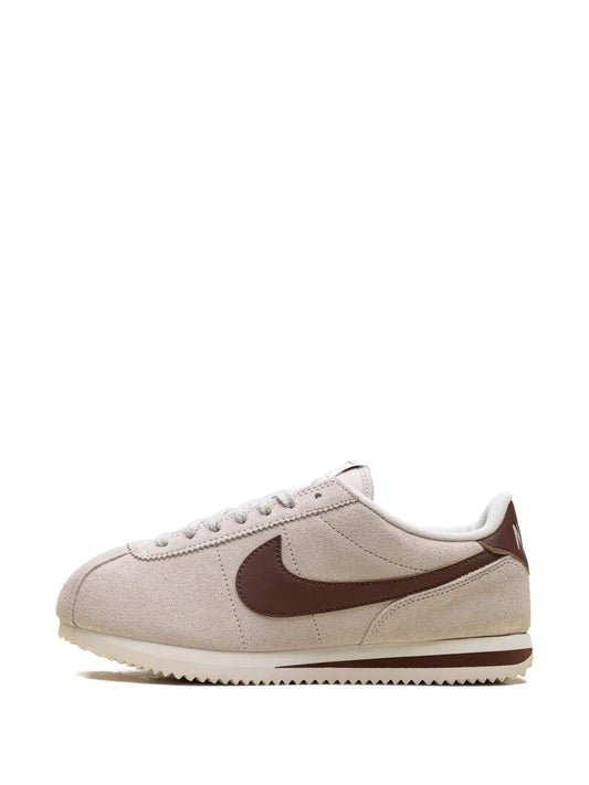 Beige suede Nike Cortez sneakers, brown Swoosh lace-up side view