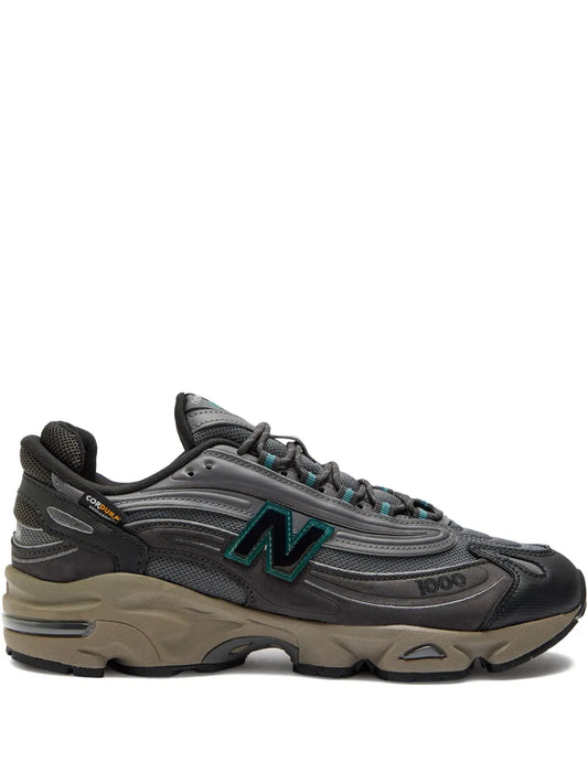 New Balance 1000 grey athletic sneaker with teal N logo and black laces