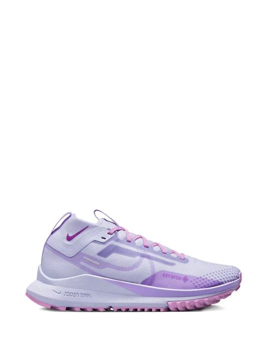 Nike trail running sneakers, purple with laced upper and Nike swoosh