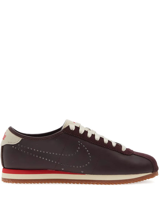Nike leather sneakers in dark maroon, cream laces, gum sole with red stripe