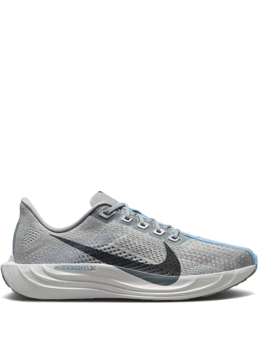 Nike men's grey road running shoe with black swoosh and blue detailing