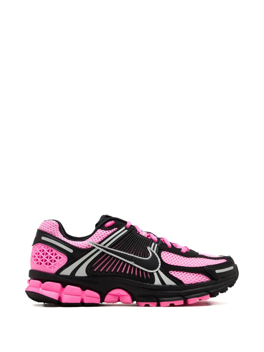 Nike Zoom Vomero 5 running shoes in pink, black, and white; lace-up with chunky sole