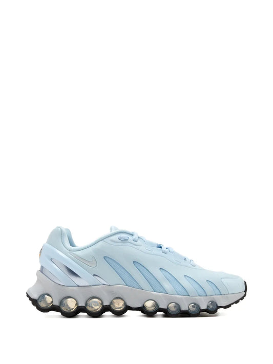 Nike Air Max Dn8 light blue sneakers with lace-up front and visible pod-style outsole