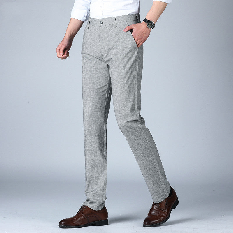 Grey men's slim-fit thin pants with side pockets and cuffed hem