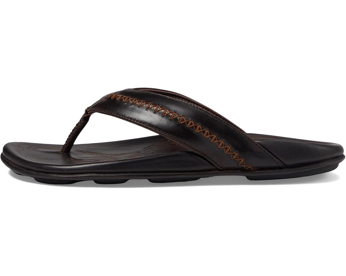 Men's OluKai Mea Ola thong flip-flops, dark brown leather profile with tan stitching