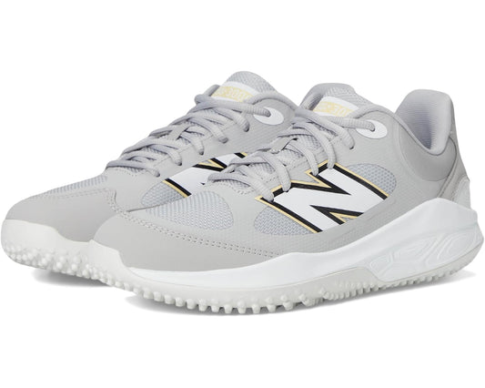 Men's New Balance turf trainer, light gray/white, lace-up with black and gold accents