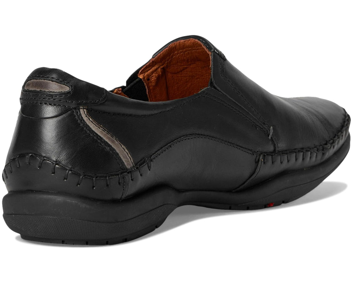 Men's black leather slip-on shoe, rear view, with orange-brown interior lining