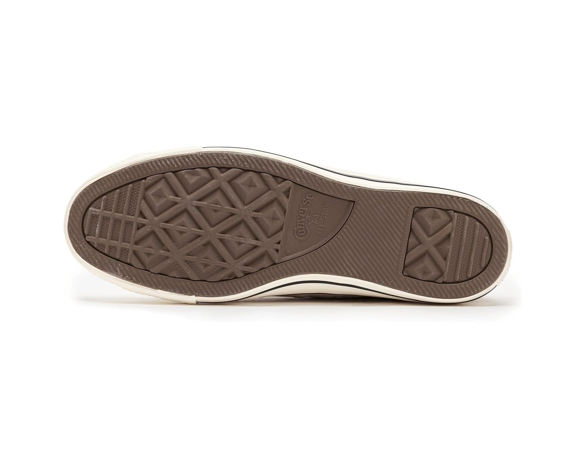 Converse suede low-top sneaker outsole with dark rubber tread and beige sidewall
