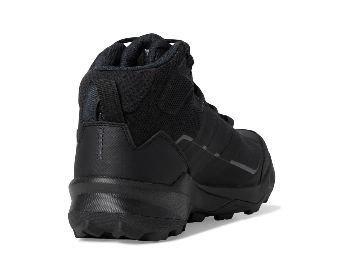 Black hiking boot heel and collar with lace-up loops and rubber outsole