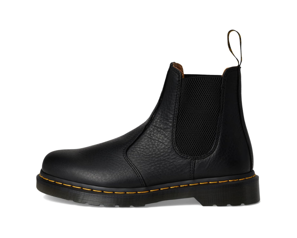 Unisex black leather Chelsea boot with elastic gore, lace-free pull tab, and yellow welt