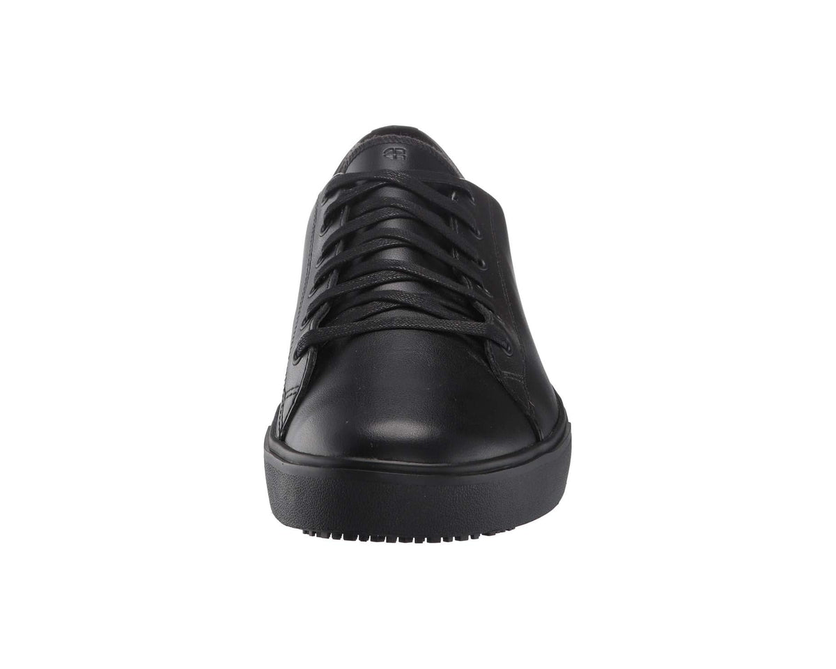 Black lace-up low-top shoe front view with toe cap and dark textured outsole