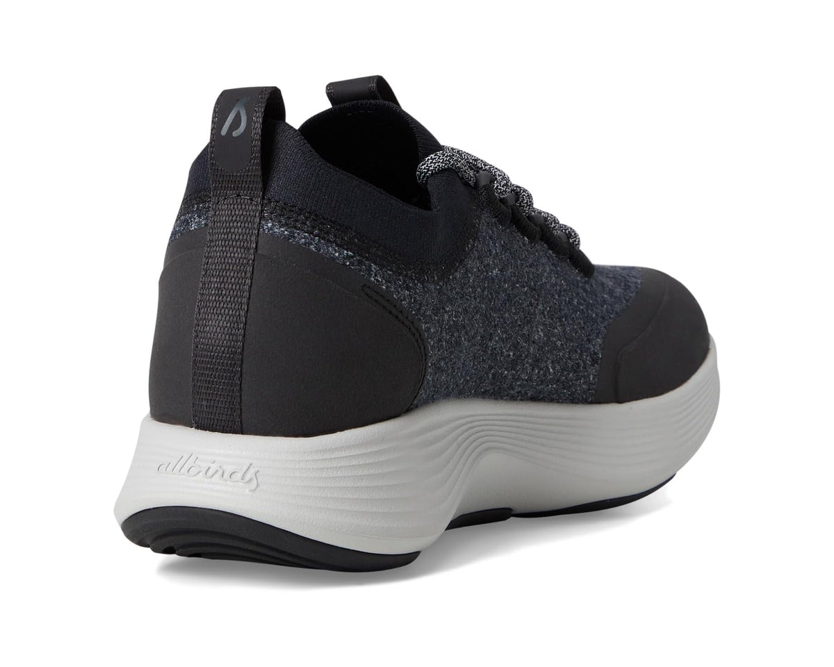 Dark grey speckled sneaker heel with black back tab and white cushioned sole