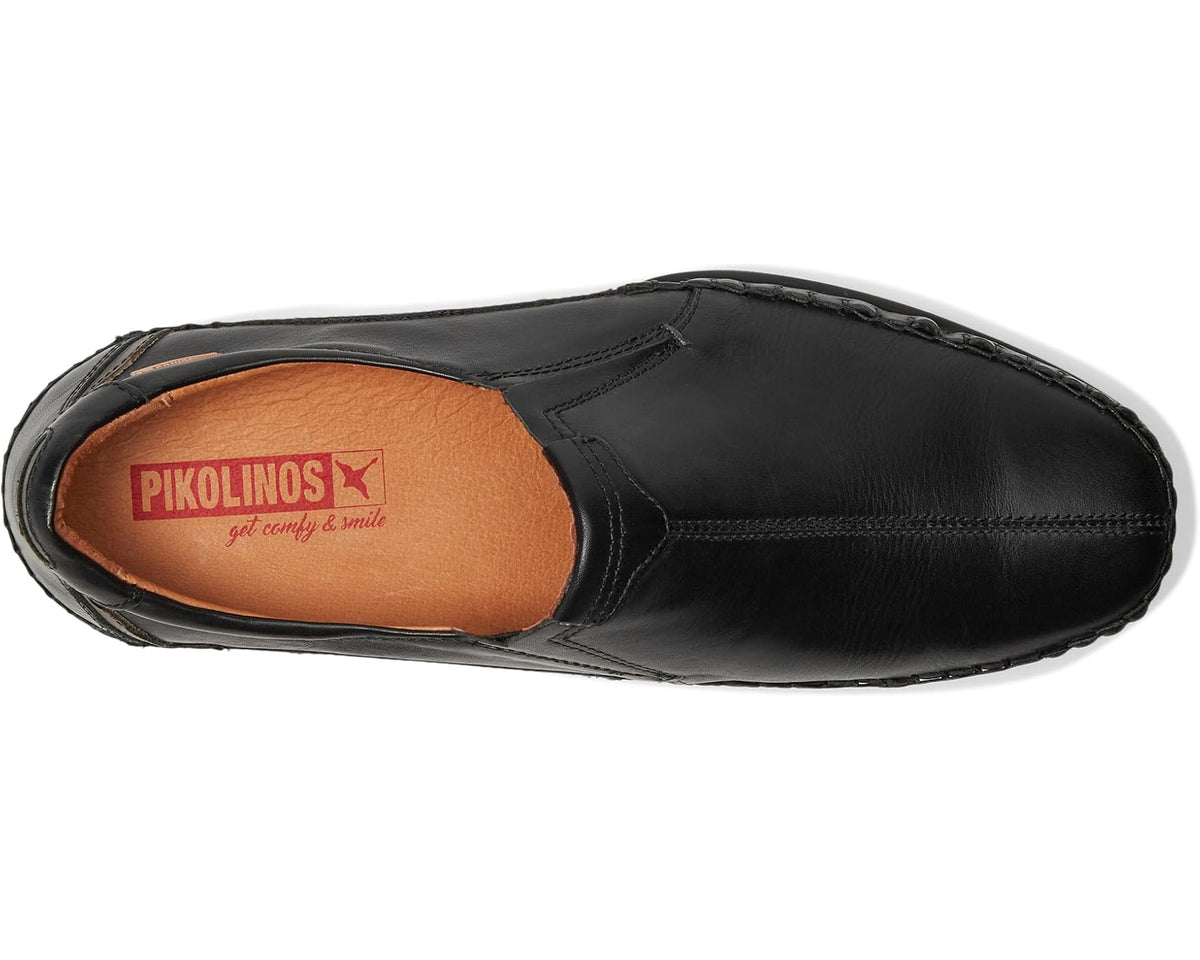 Men's black slip-on shoe with tan insole lining and PIKOLINOS logo