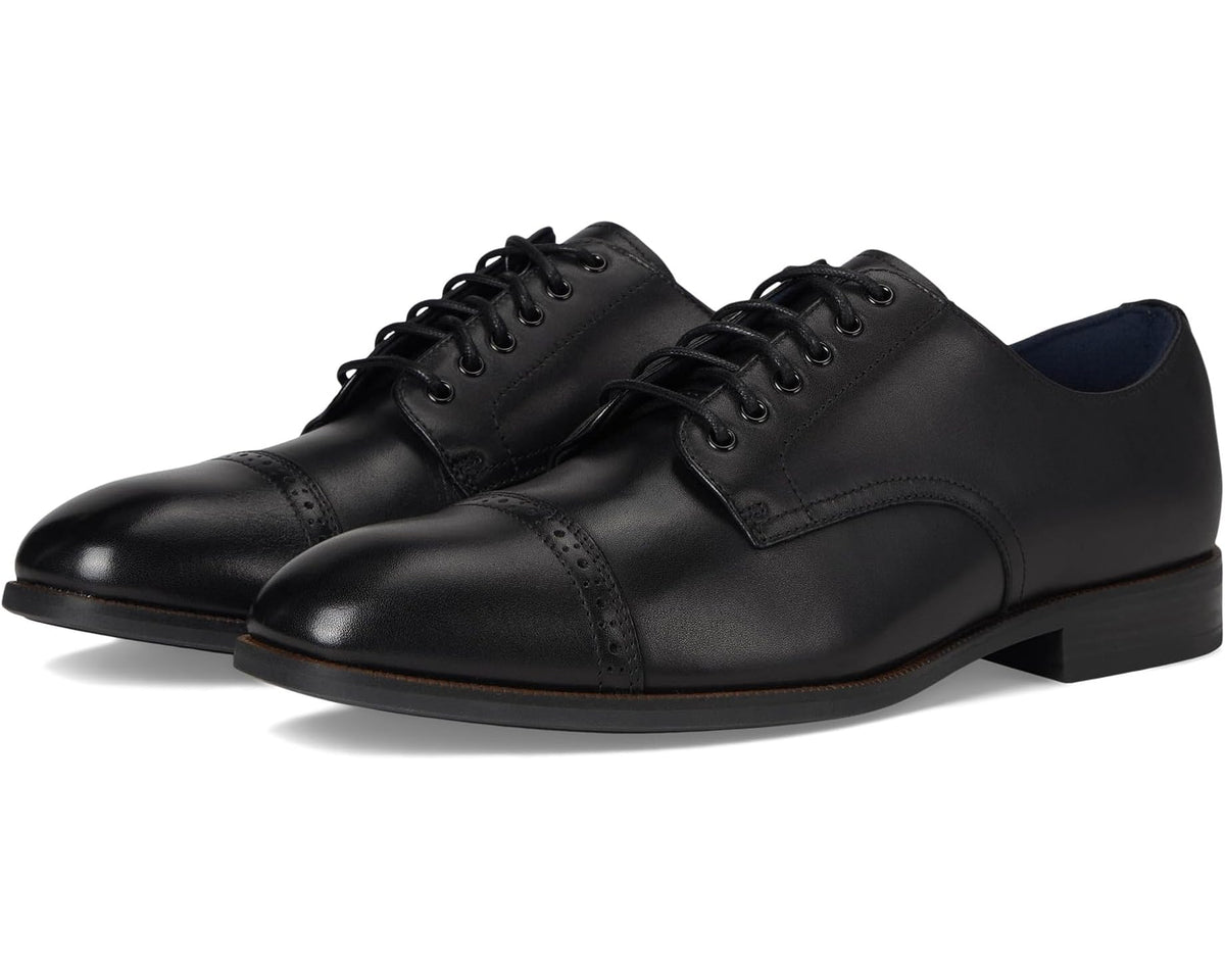 Black cap-toe lace-up dress shoes with perforated toe and black laces.