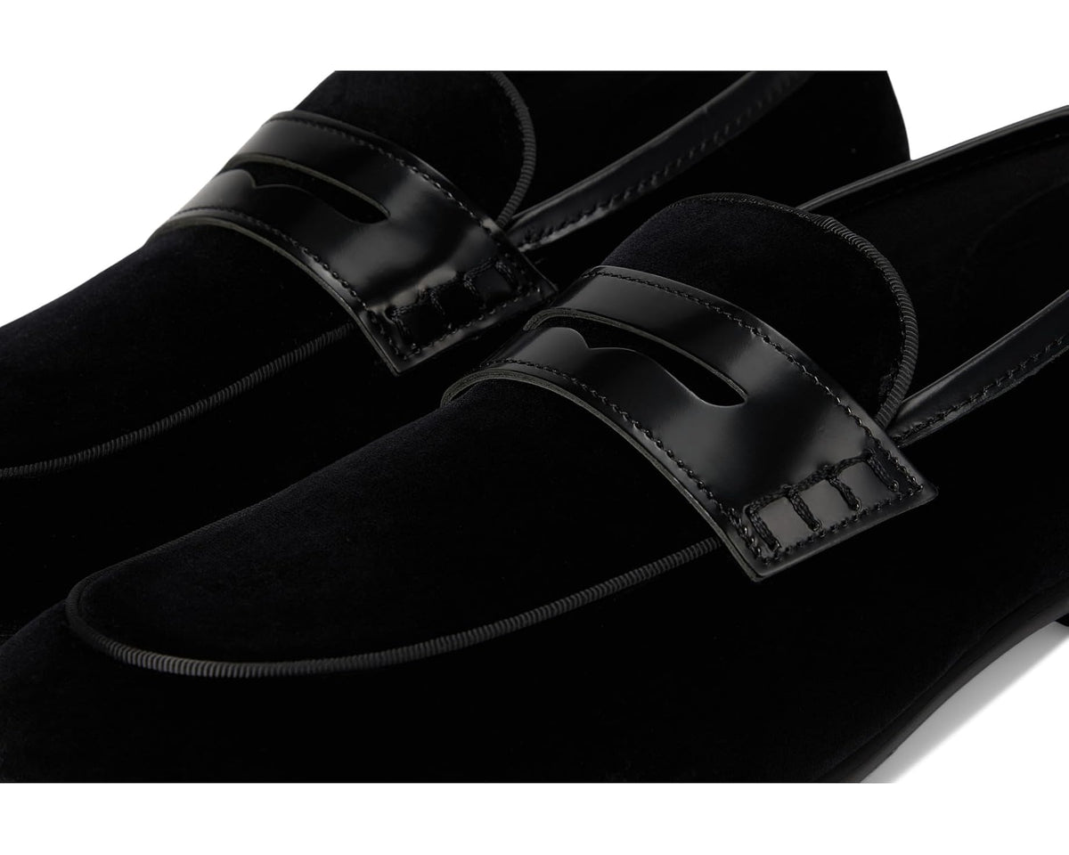 Black suede loafer with glossy strap and buckle keeper detail