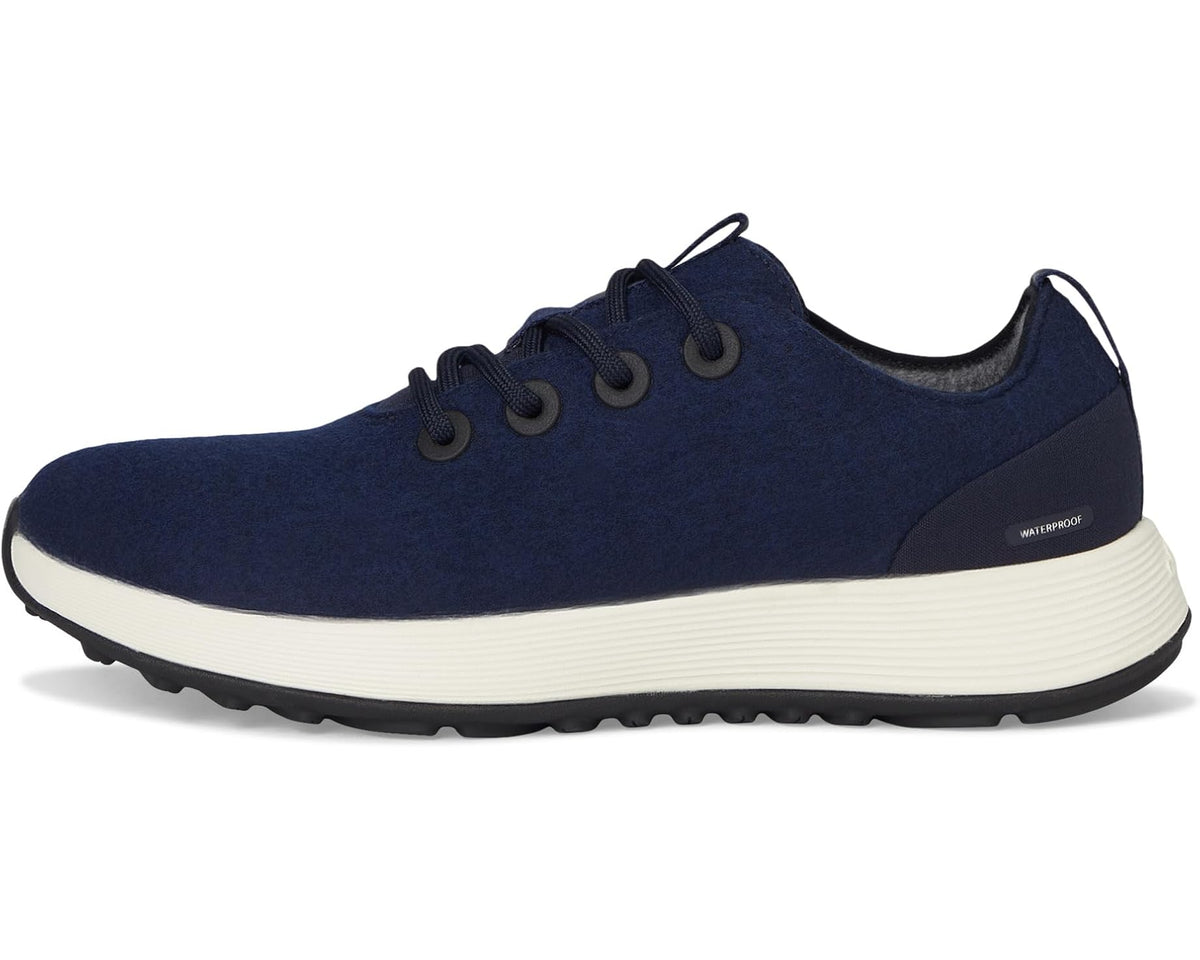 Navy lace-up runner sneaker with white midsole, side stitch detailing, and dark outsole