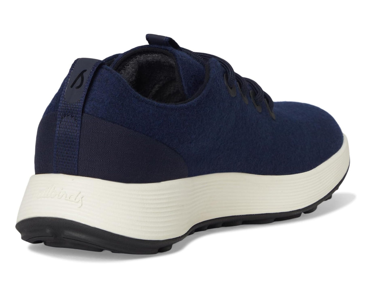 Back view of navy lace-up sneaker with padded collar, heel tab, and white midsole
