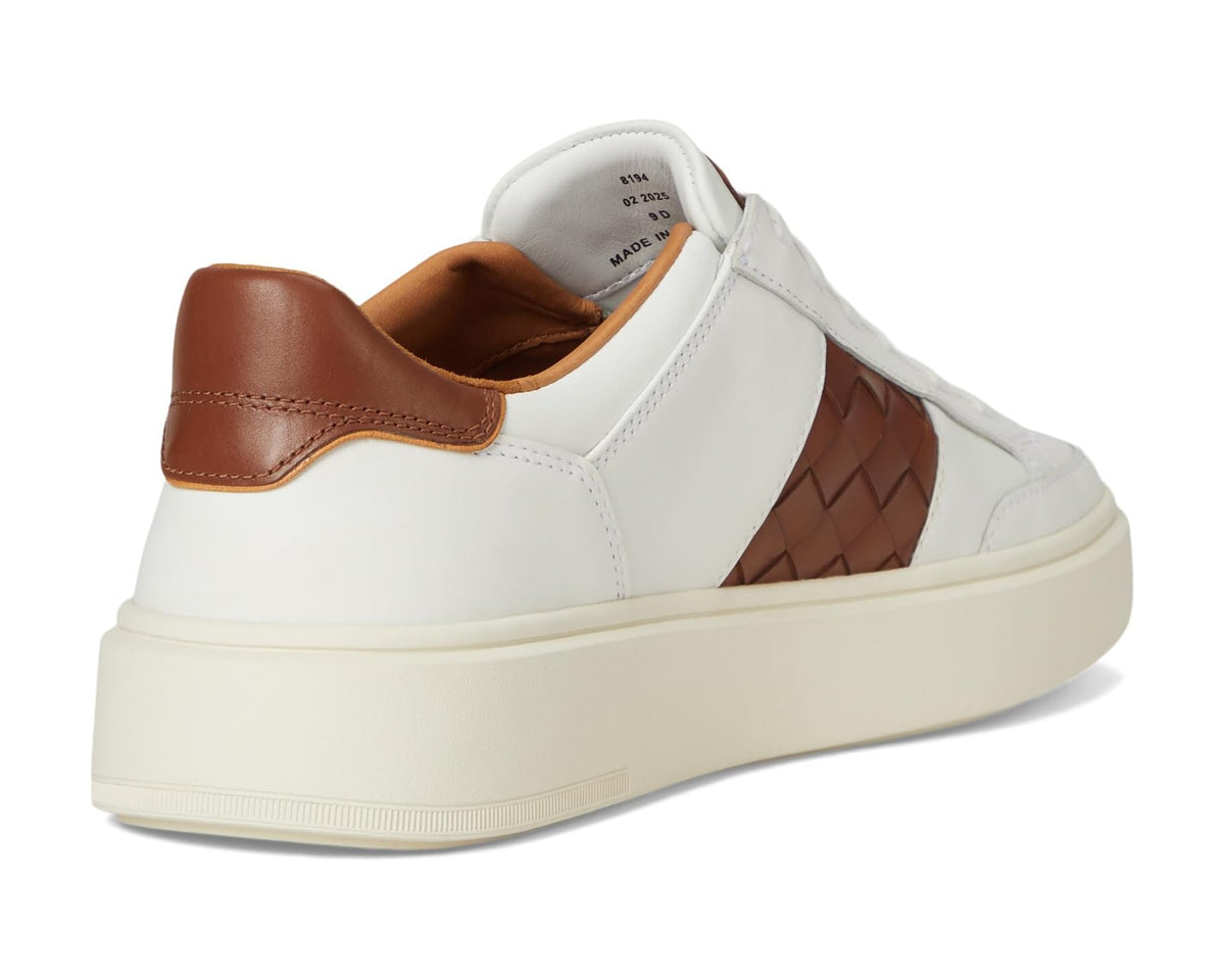 Men's white sneakers with brown leather heel tab, cushioned collar, lace-up