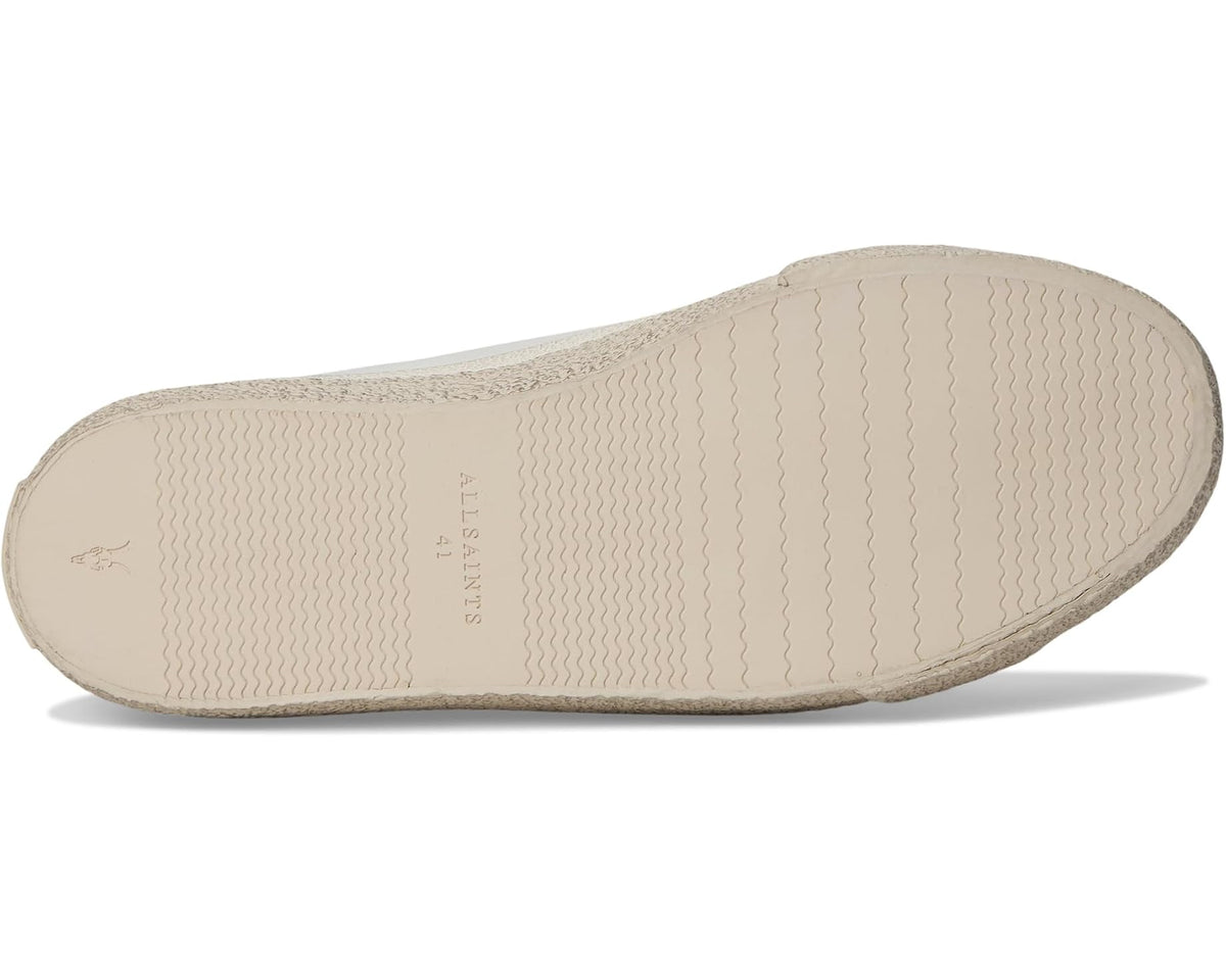 Men's white leather low-top sneakers, textured rubber outsole underside