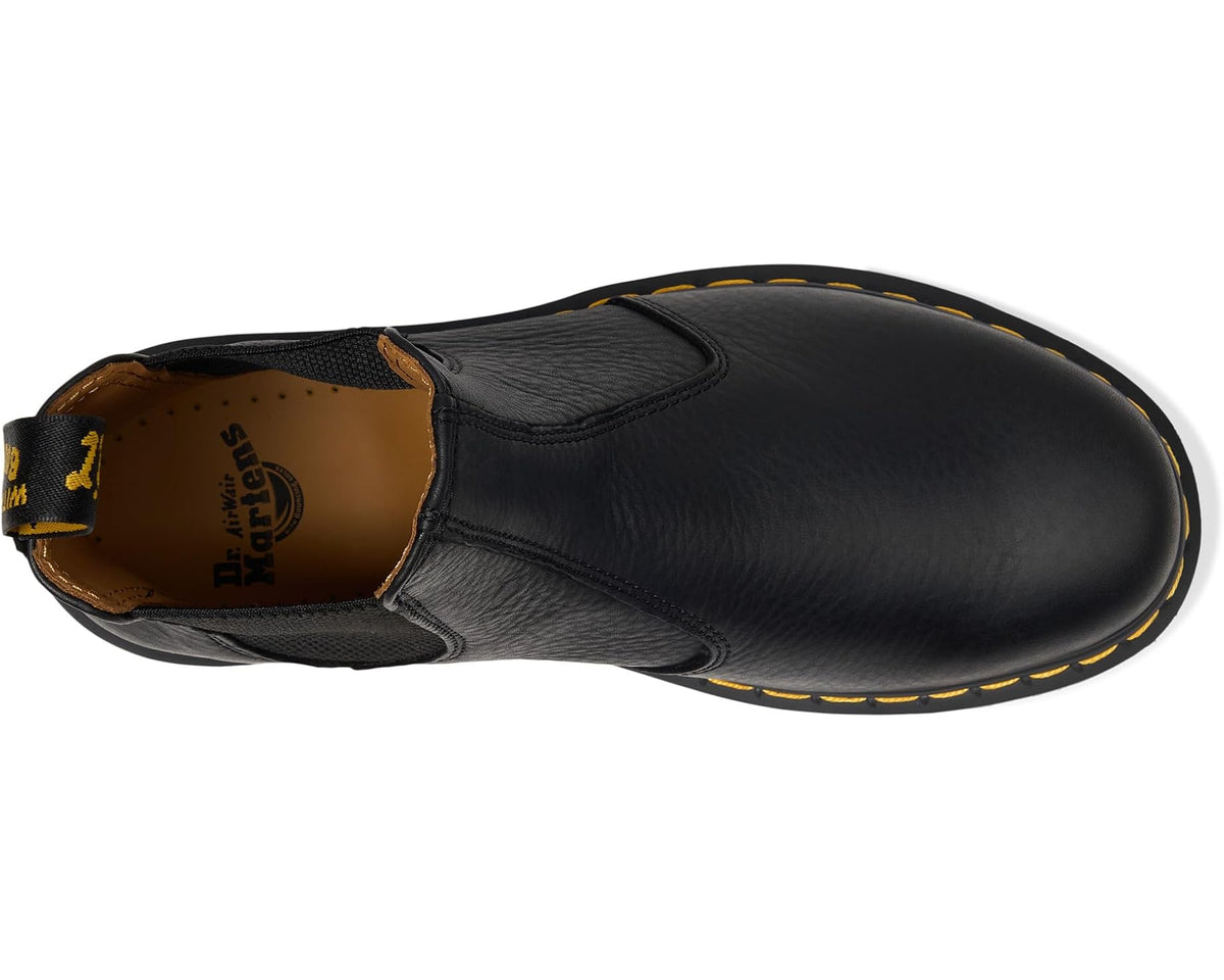 Unisex black leather Chelsea boot side view with elastic gore and yellow edge stitching