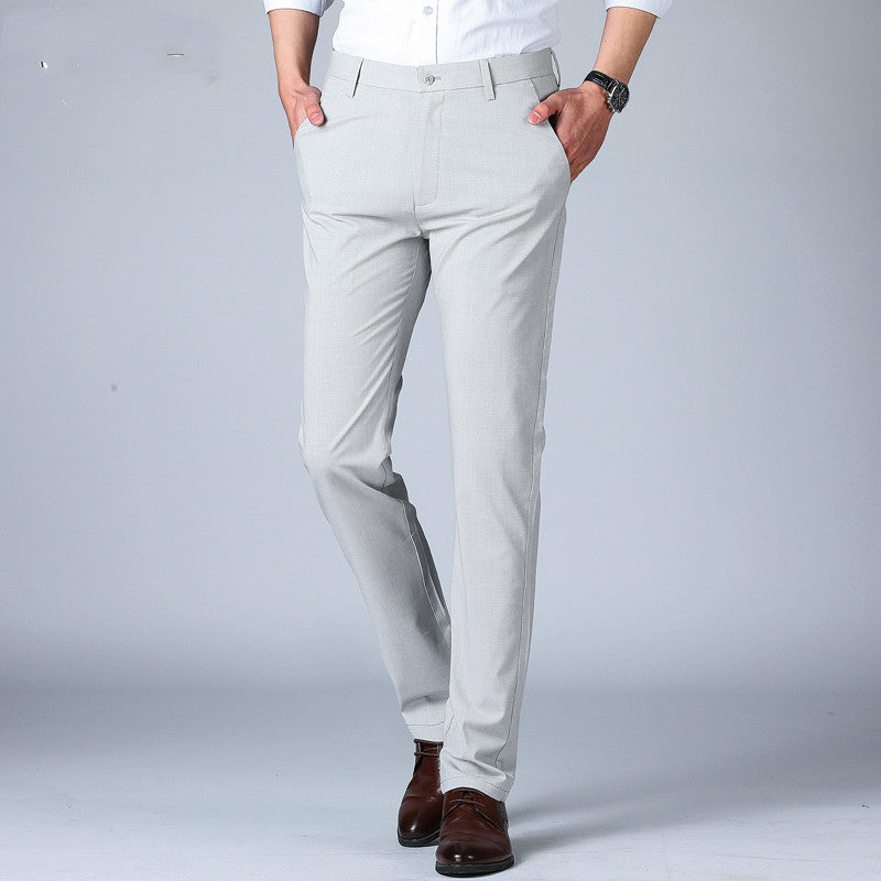 Light grey men's slim-fit thin pants with belt loops and button fly