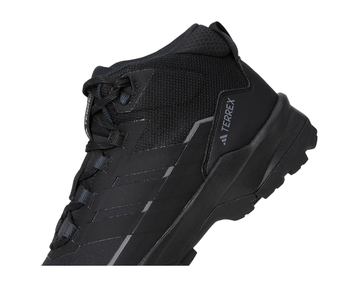 Black hiking shoe side close-up with lace-up panel and TERREX branding