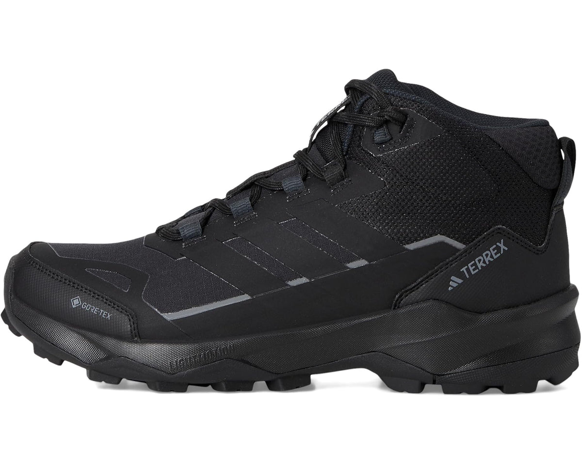 Black mid-top hiking shoe profile with lace-up system and side logo