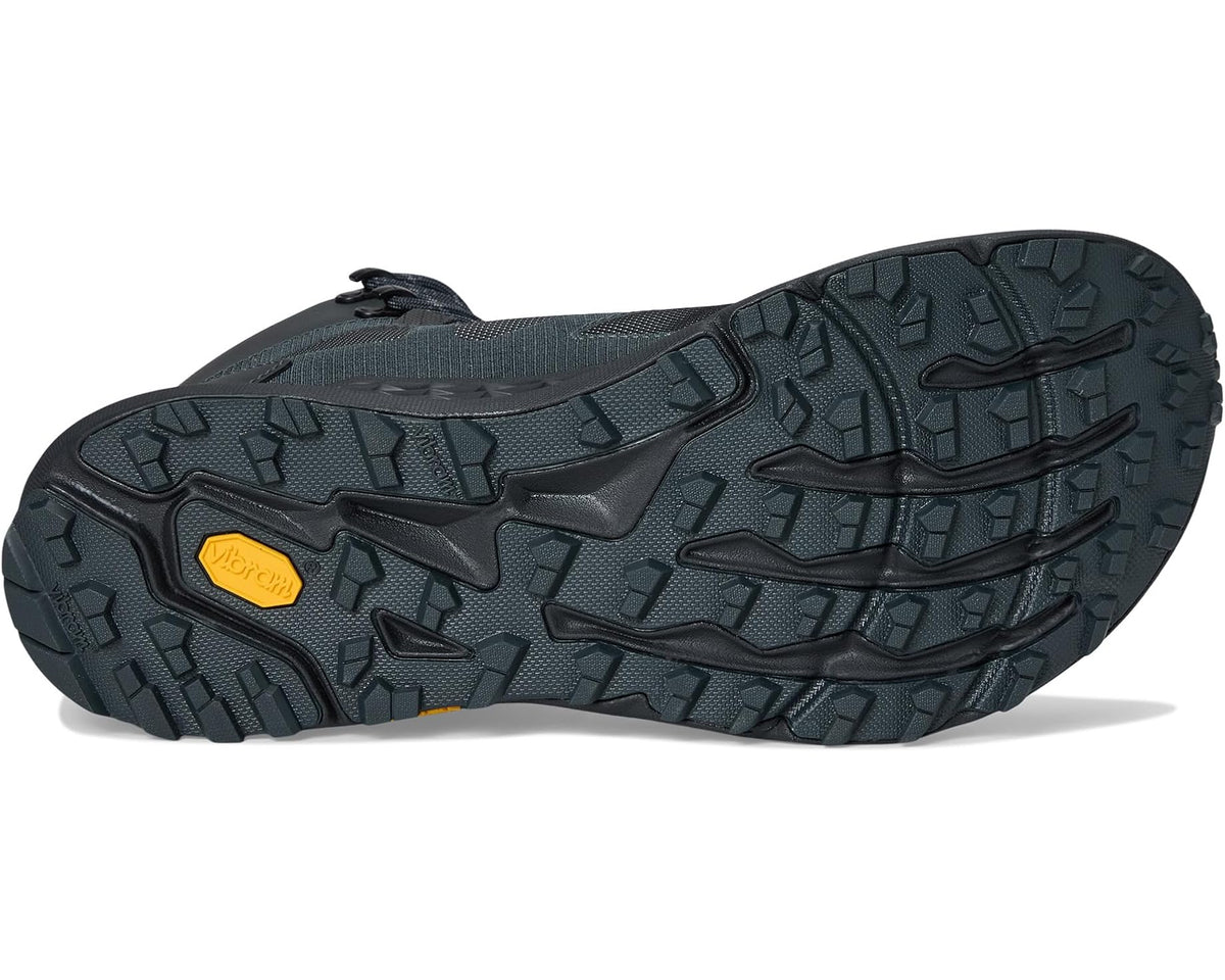 Black hiking boot outsole with deep tread and rugged traction lugs