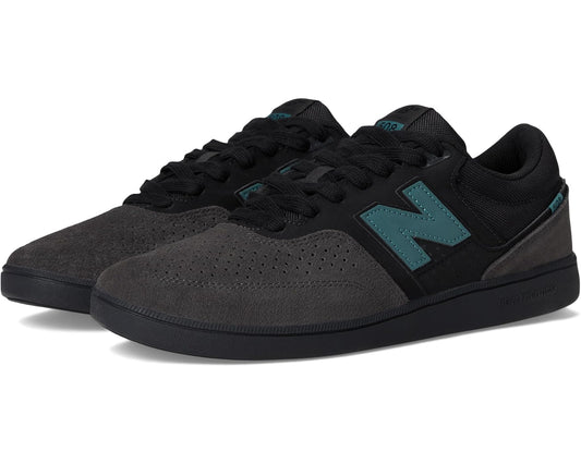 Unisex New Balance skate shoe in dark grey with teal accents and black laces