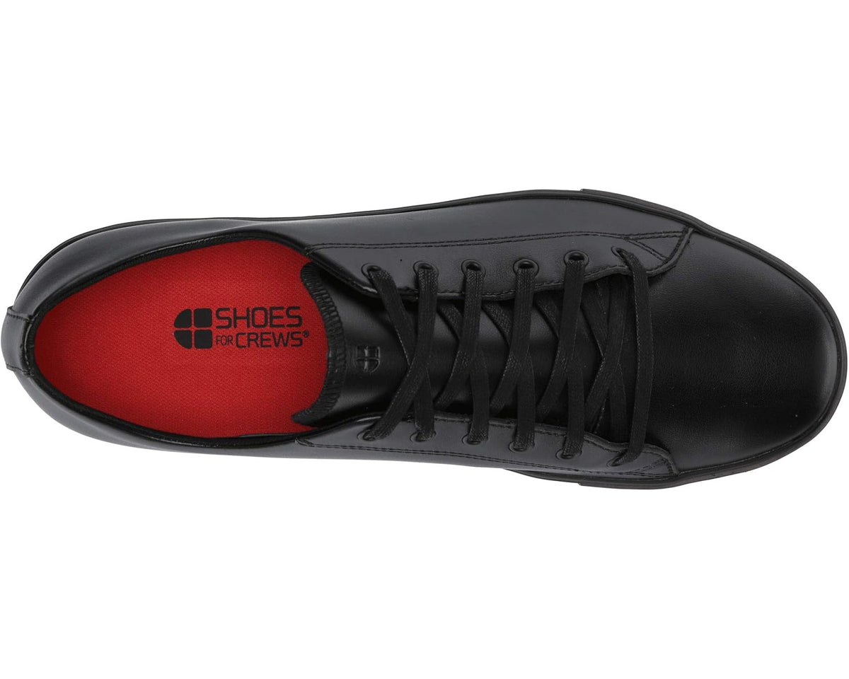 Black lace-up low-top shoes with black laces and Shoes for Crews logo insole