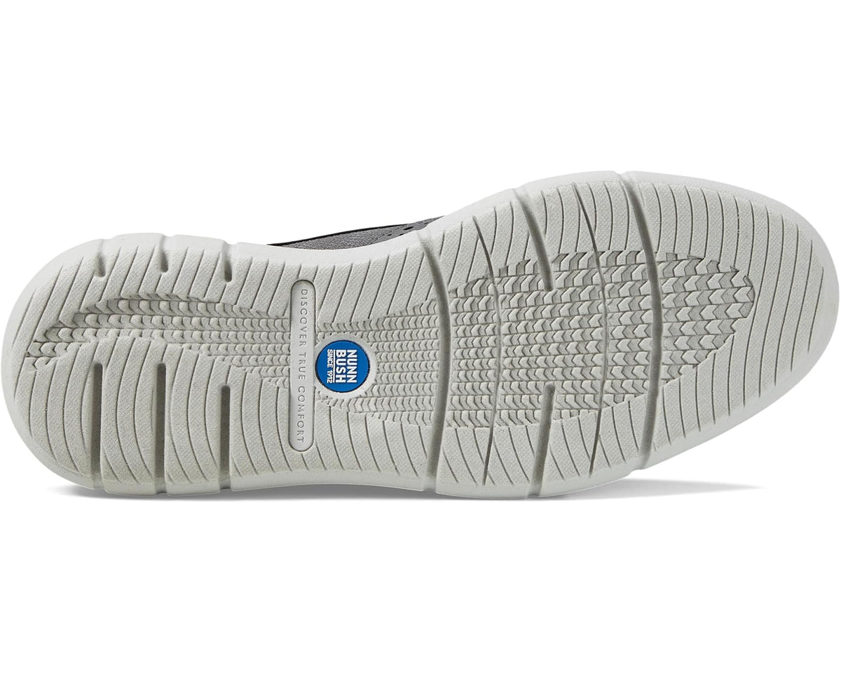 Gray sneaker outsole tread with blue size label on rubber sole