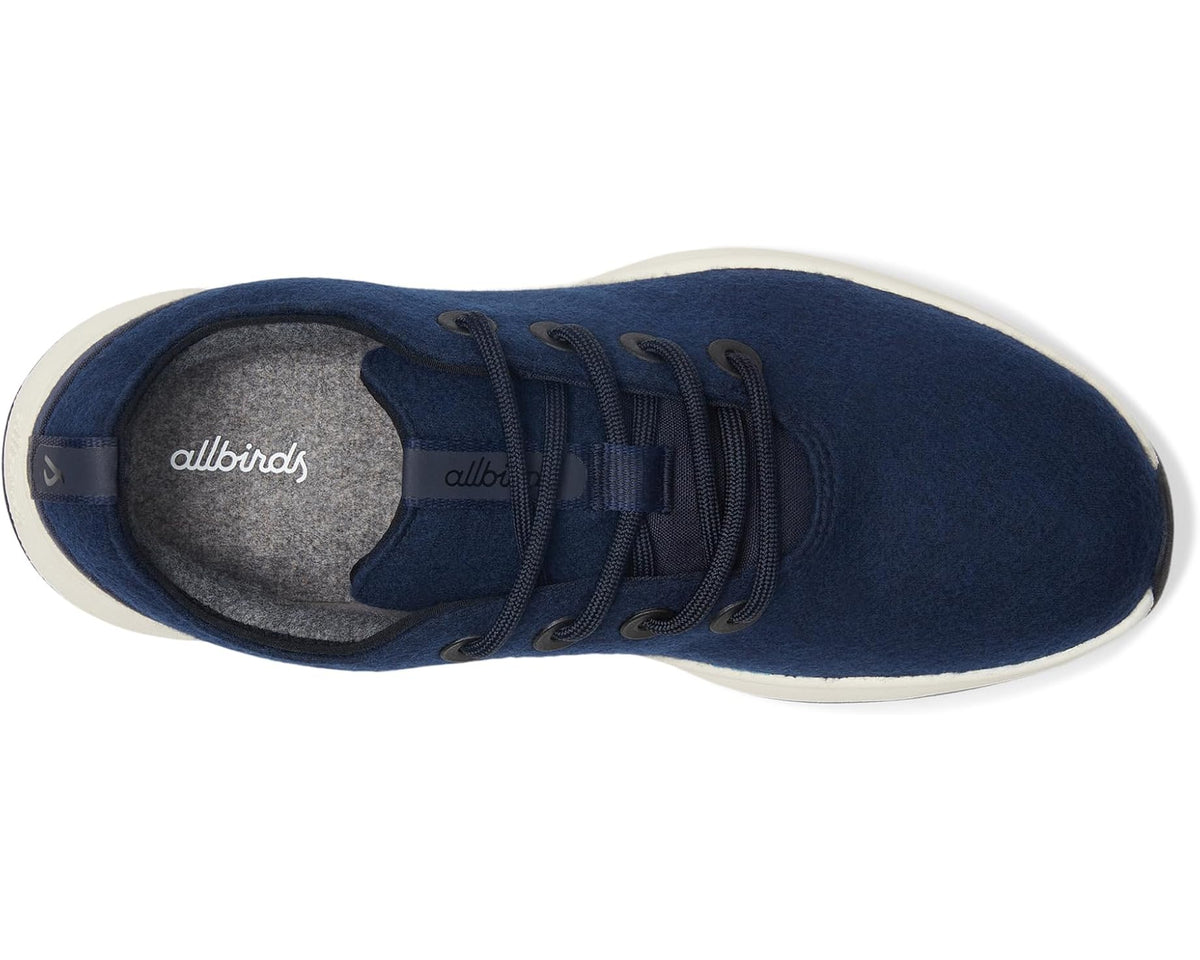 Navy lace-up sneaker with gray interior lining and textured white sidewall sole
