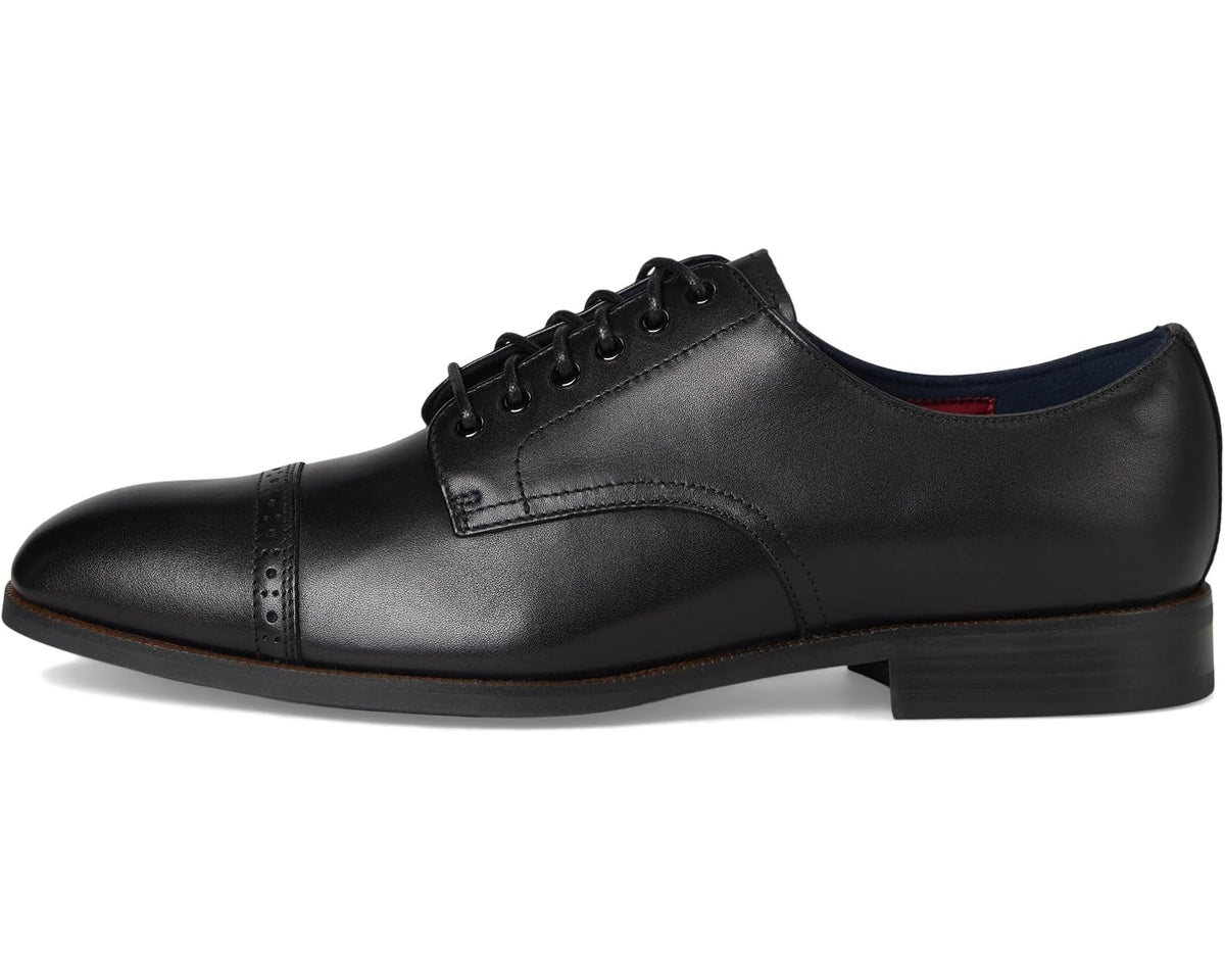 Black cap-toe lace-up dress shoe with side perforations and low block heel.