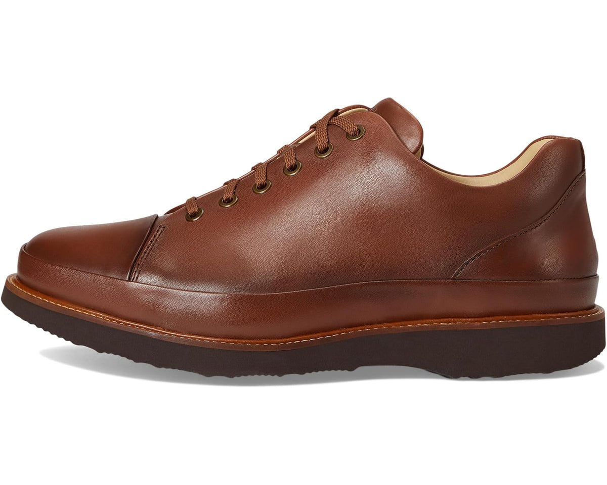 Cognac leather lace-up dress shoe with rounded toe and cushioned collar