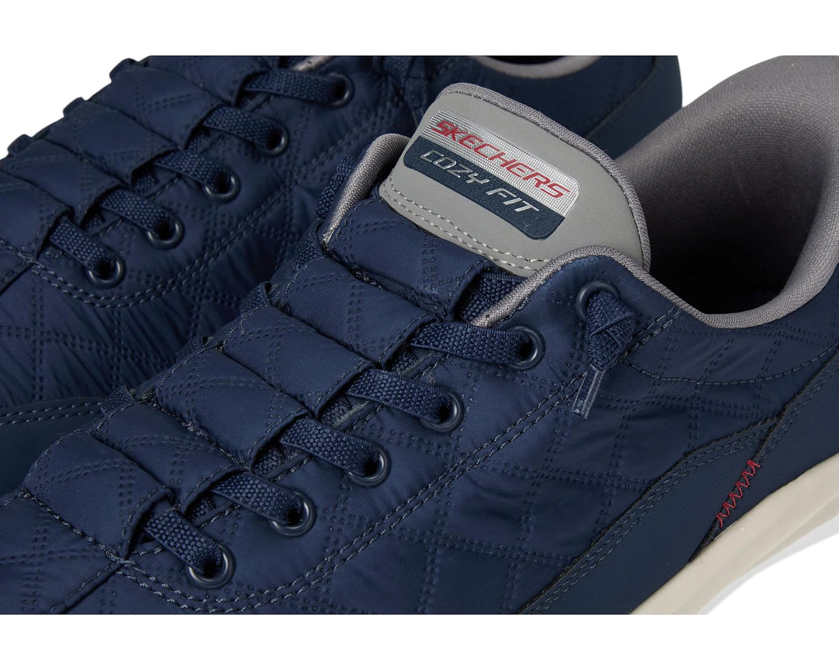 Navy SKECHERS sneaker upper close-up with lace panel and logo patch