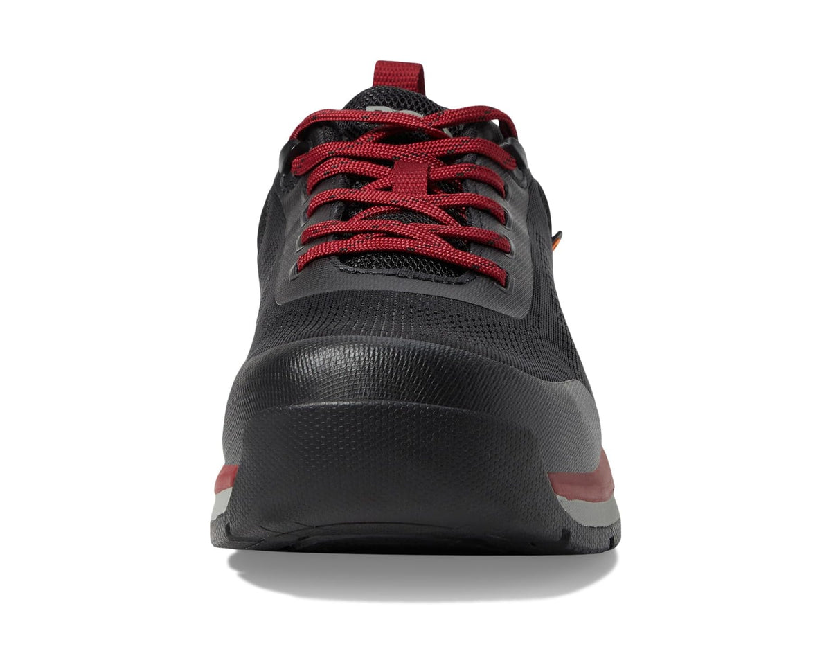 Men's black sneakers with red laces and textured toe cap view