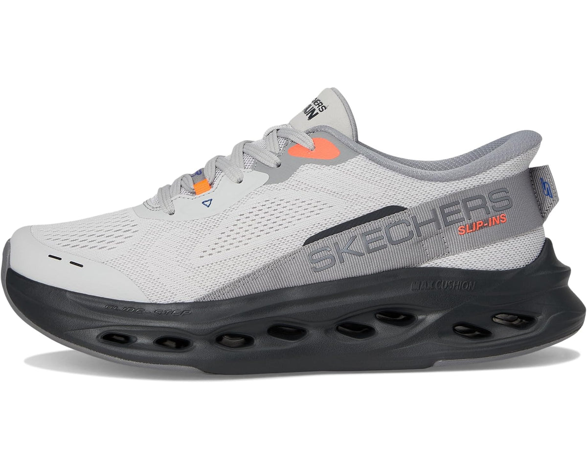 Men's gray slip-on sneaker with black midsole, SKECHERS branding, orange logo