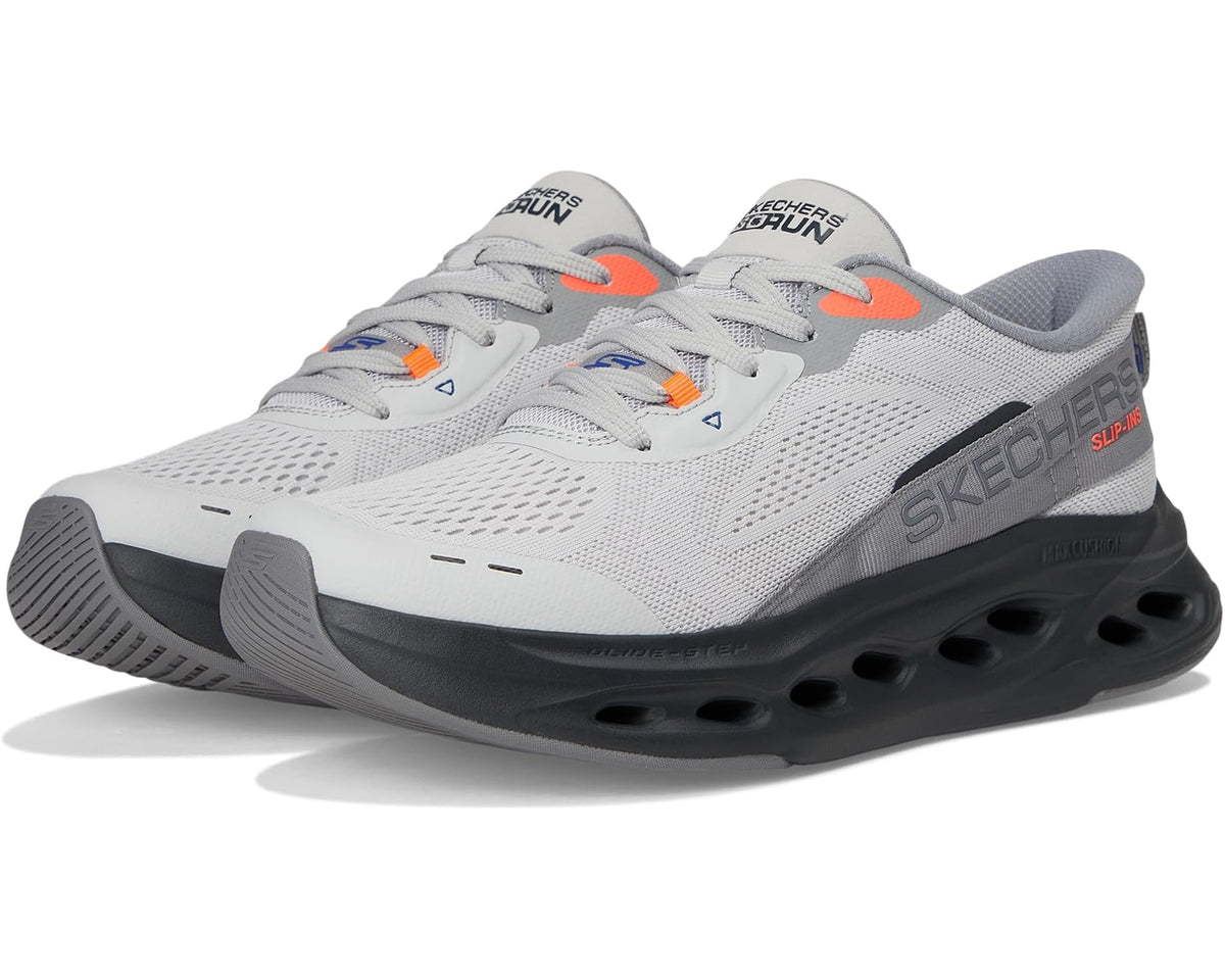 Men's gray slip-on sneaker with black cushioned sole and orange accents