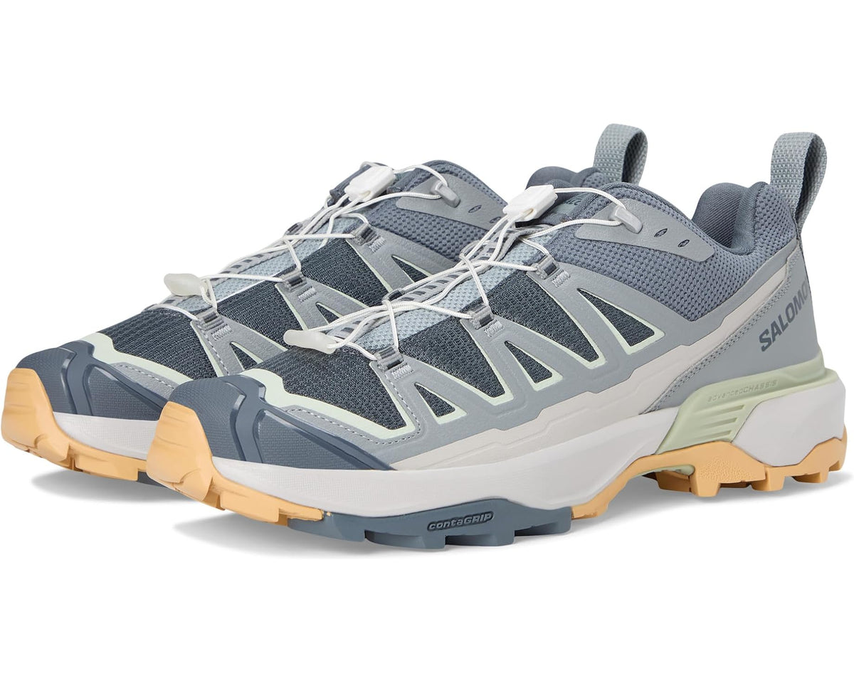 Men's trail running shoe in blue-gray with light green and tan accents, lace-up