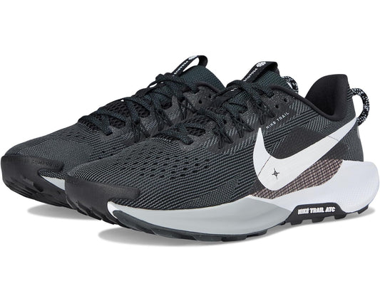 Trail running sneaker in black mesh with white Nike swoosh and lace-up design
