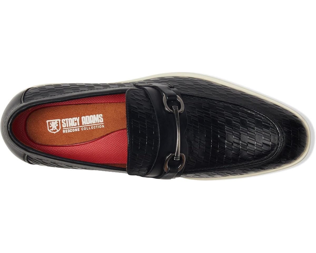 Black moc toe slip-on loafers with strap buckle and tan-lined interior