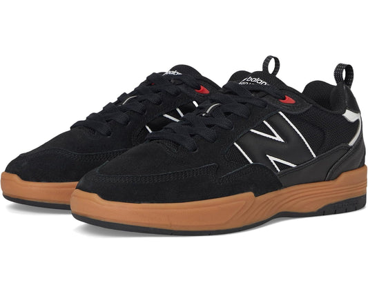 Black New Balance Numeric 808 low-top sneakers with gum rubber sole