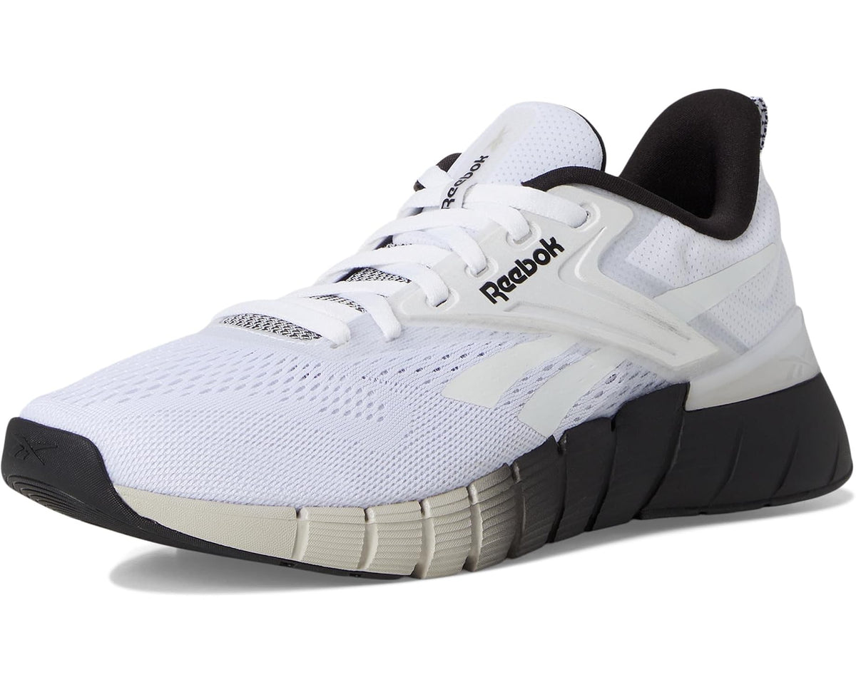 Reebok Nano gym shoes, white with black heel and textured midsole cushioning