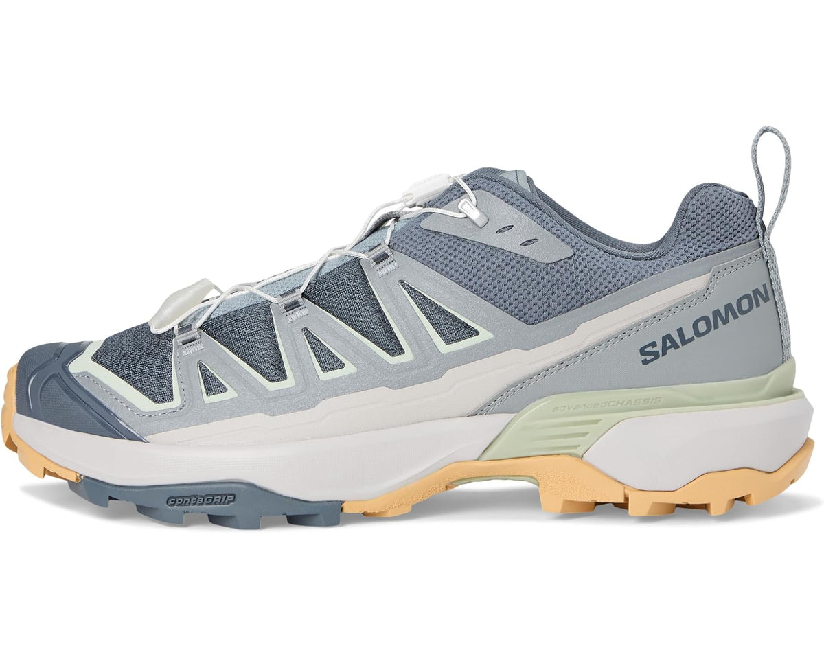 Men's Salomon trail shoe with blue-gray upper, white overlays, light green midsole