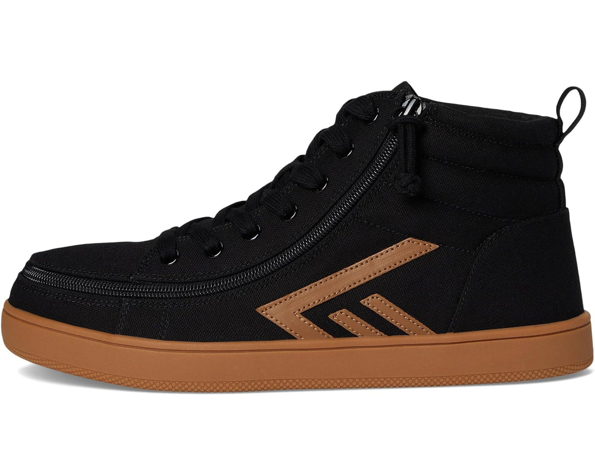 Black high top casual shoe with lace-up and side zipper, tan chevron side panel, gum sole